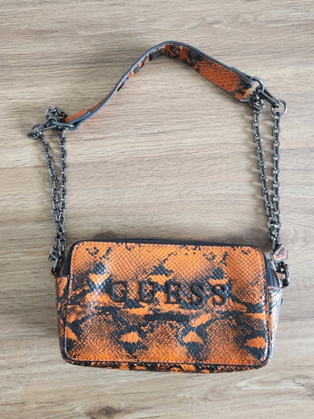 Gently used Guess Orange & Black Snake Pront Crossbody Camera Bag